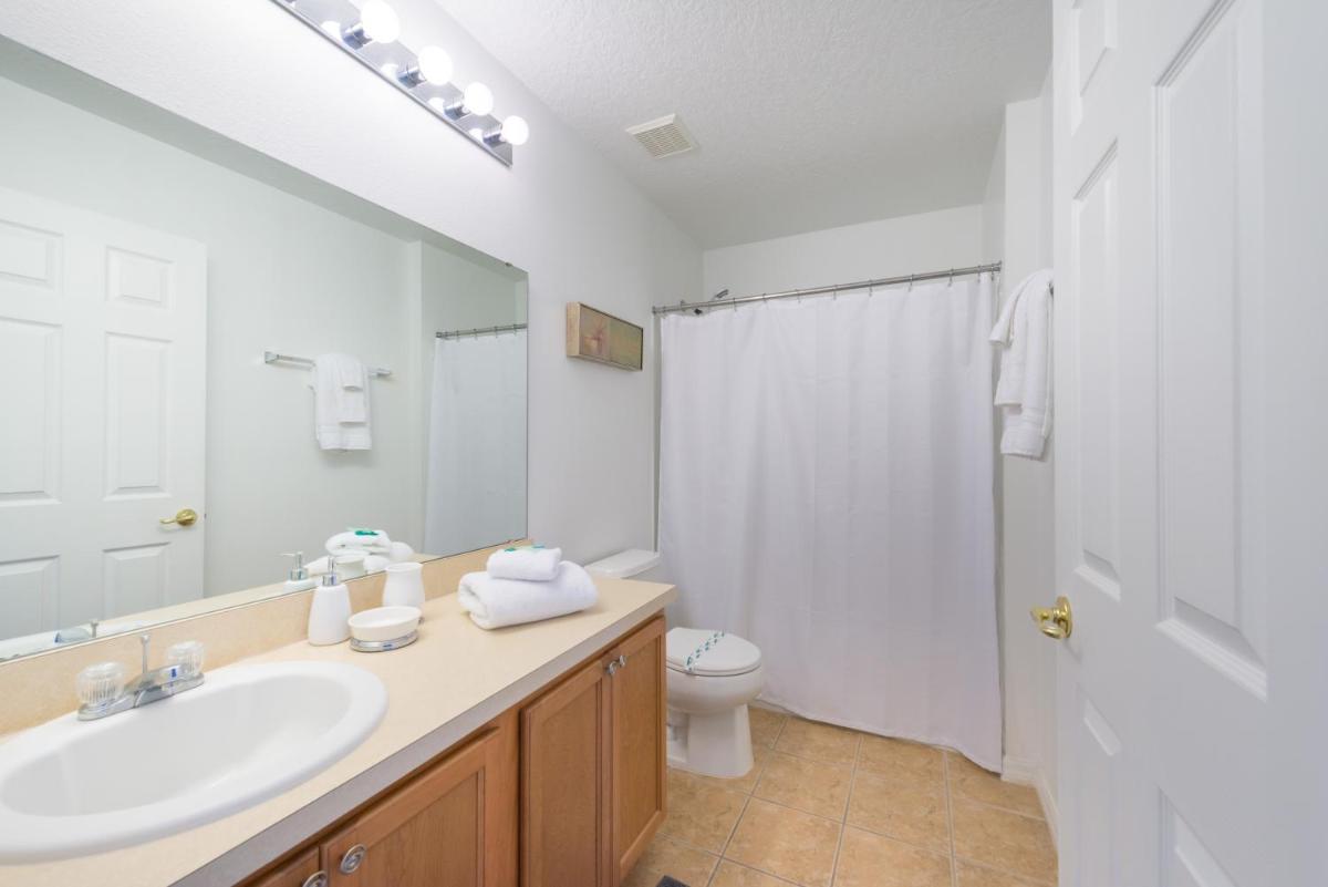 Disney Retreat- 5 bedroom vacation home with 3 seperate living areas a private pool and spa and game room - image 6