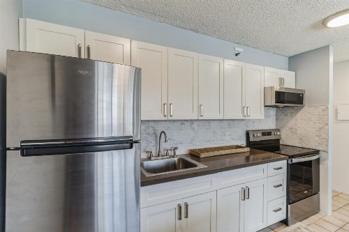 Tower 2 Suite 1208 -QQE condo - image 6
