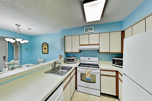 Oceanside Gem with Private Deck Canal Views & Pools condo - image 10