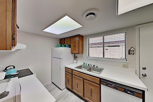 Coastal Getaway with Pool - Stroll to Beach & Dining condo - image 12