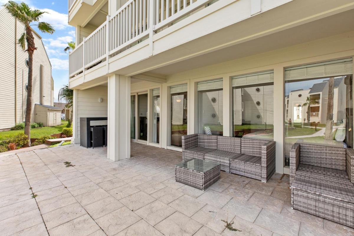 NEW LISTING! Ground floor with spacious patio! Steps to the beach and pool - image 7