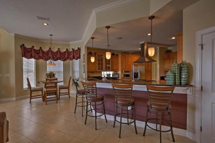 Lavish Waterfront Home with Pool and Shared Dock! - image 11