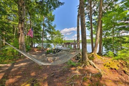 Calm Waterfront Great Pond Cottage with Hot Tub Deck Maine