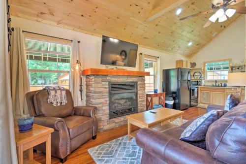 Charming Riverfront Cabin with Private Deck and Hot Tub - main image