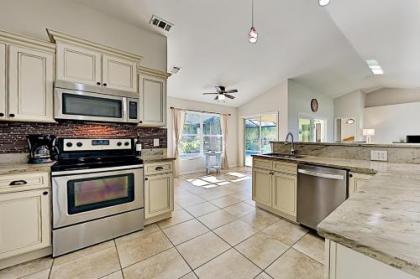 Surfside Oasis   Screened Lanai with Heated Pool home