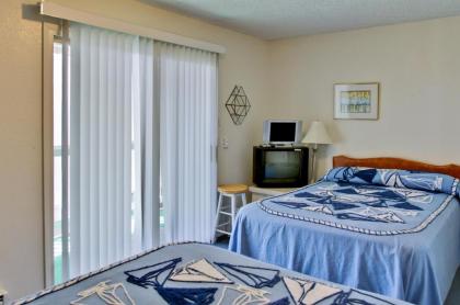 Oceanfront Condo Escape with Grill Walk to Beach! - image 15