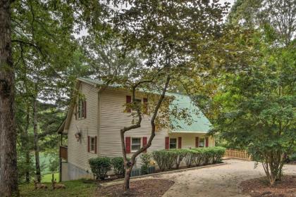 Spacious Riverfront Retreat with Deck and Hot Tub - image 3