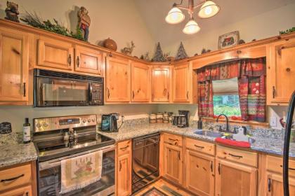Spacious Riverfront Retreat with Deck and Hot Tub - image 8