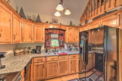 Spacious Riverfront Retreat with Deck and Hot Tub - image 9