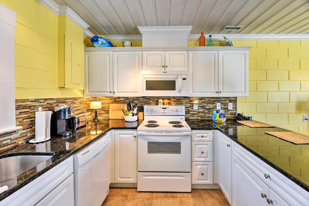 Colorful Cottage with Patio Across from the Beach! - image 3