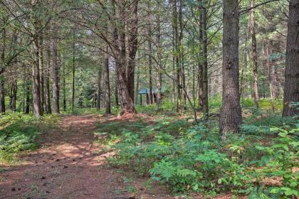 Secluded Log Cabin in NW Michigan with Fire Pit and Deck - image 3