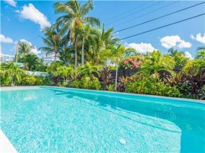 Coco Palm Escape: 5 Min Walk to Beaches 5 Star Home 4/2 Feet to BEACH Heated Pool!