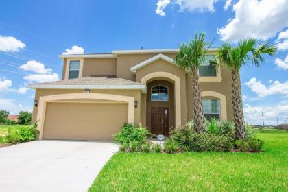 Palm Golf  6 Bedroom Home with a south facing pool relaxing spa and game room in a gated resort