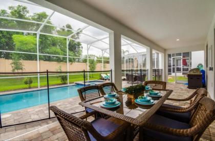 Elegant Centerpiece Pool Retreat in Champion Gates Davenport Florida