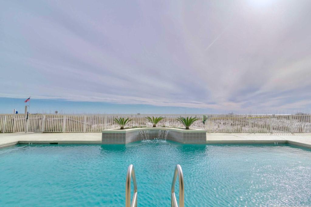 Beachfront Gulf Shores Condo with Patio and Pool Access - image 2