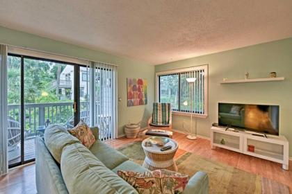 Beach Condo with Pool Access and Porch about half Mi to Shore!