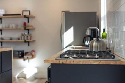 Modern minimalist comfort 5 minutes from downtown - image 2