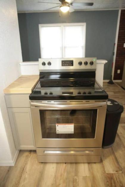 1 bedroom with a fireplace close to base - image 11