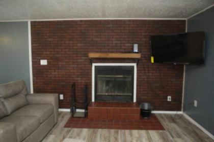1 bedroom with a fireplace close to base - image 3