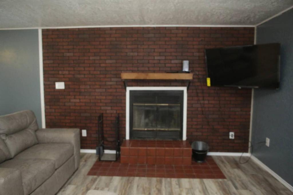 1 bedroom with a fireplace close to base - image 3