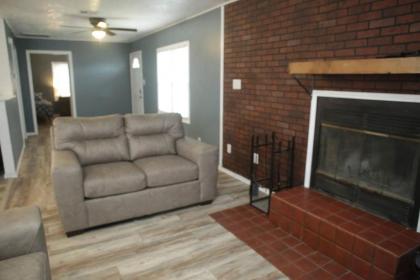 1 bedroom with a fireplace close to base - image 6