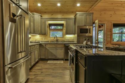 TAKE IT EASY in this Custom designed luxury log cabin is located in quiet area on paved road. - image 17