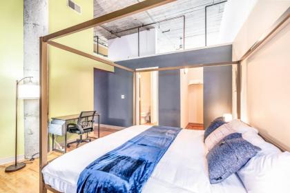 TWO Stunning Industrial Lofts by CozySuites - image 8