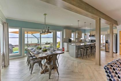 Modern Waterfront Home with Patio Fire Pit and Dock - image 1