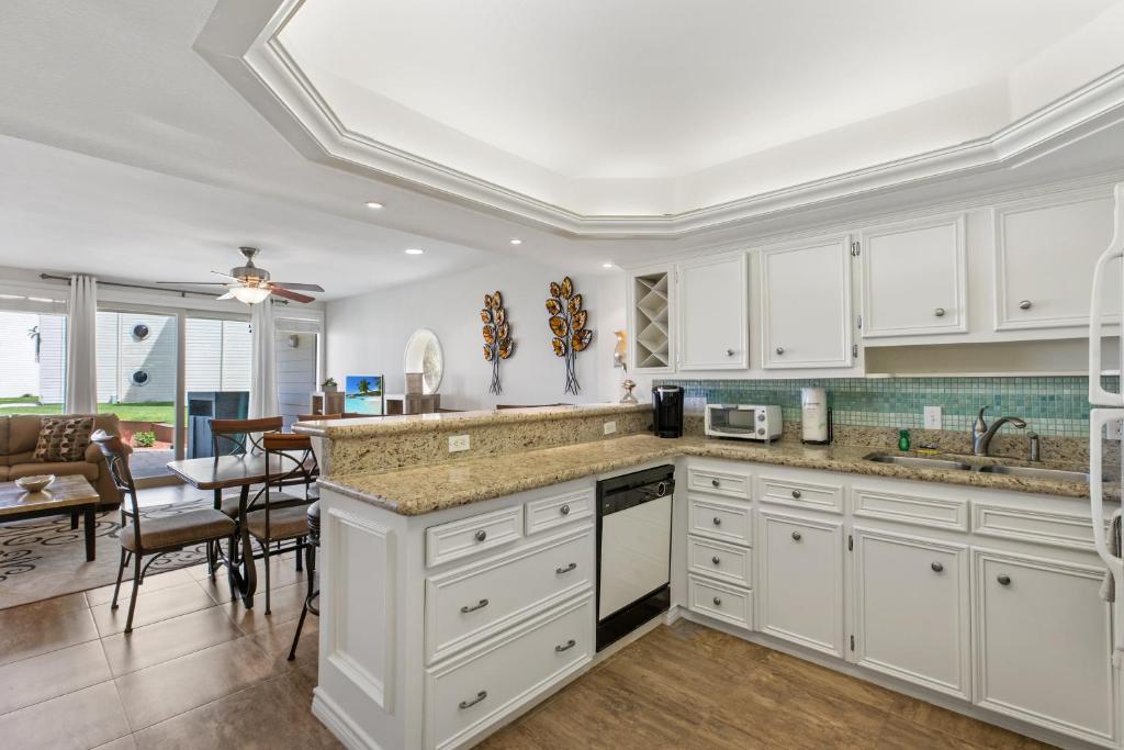 NEW LISTING! Ground floor with spacious patio! Steps to the beach and pool - image 5